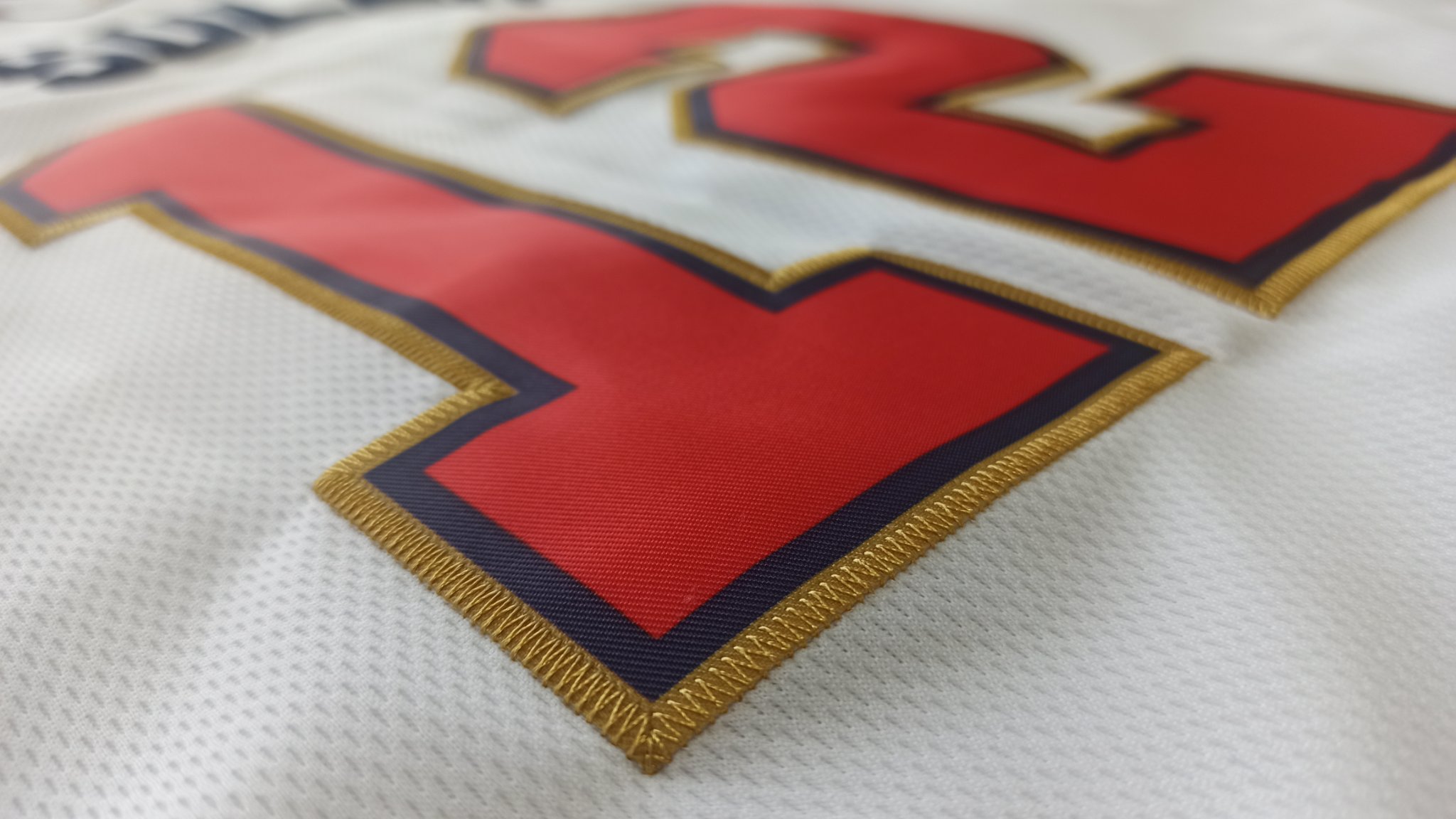 A detailed close-up of the premium tackle-twill stitching on a Ujersey Shop product